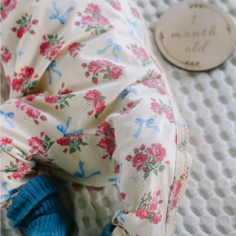 Konges Slojd Floral Bow Cream Baby Outdit with Pink Roses and Blue Ribbons